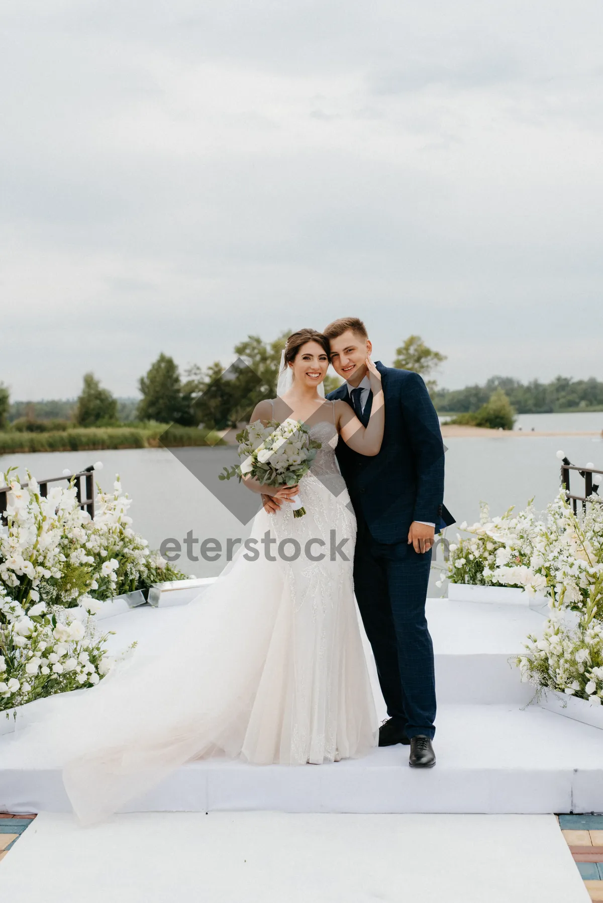 Picture of Happy wedding couple posing outdoors in love and happiness