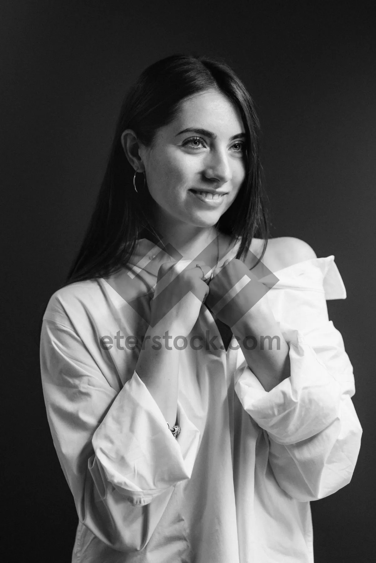 Picture of Smiling brunette businesswoman in black suit coat