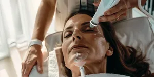 Man receiving hair treatment at salon