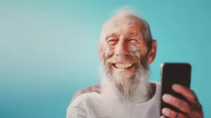 Happy elderly couple smiling together in retirement portrait.