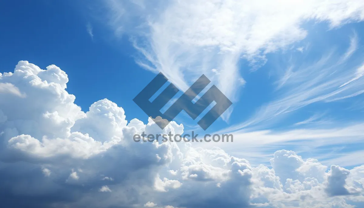 Picture of Vibrant Summer Sky with Fluffy Clouds