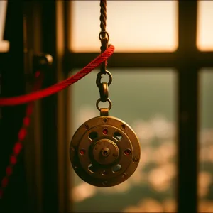 Golden Chain Pulley: Mechanical Device and Musical Decoration