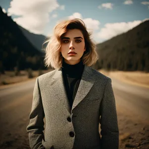 Happy brunette businesswoman smiling in a stylish jacket.