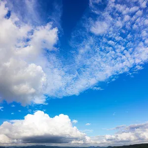 Vibrant Summer Skies: Bright Sunlight, Azure Clouds