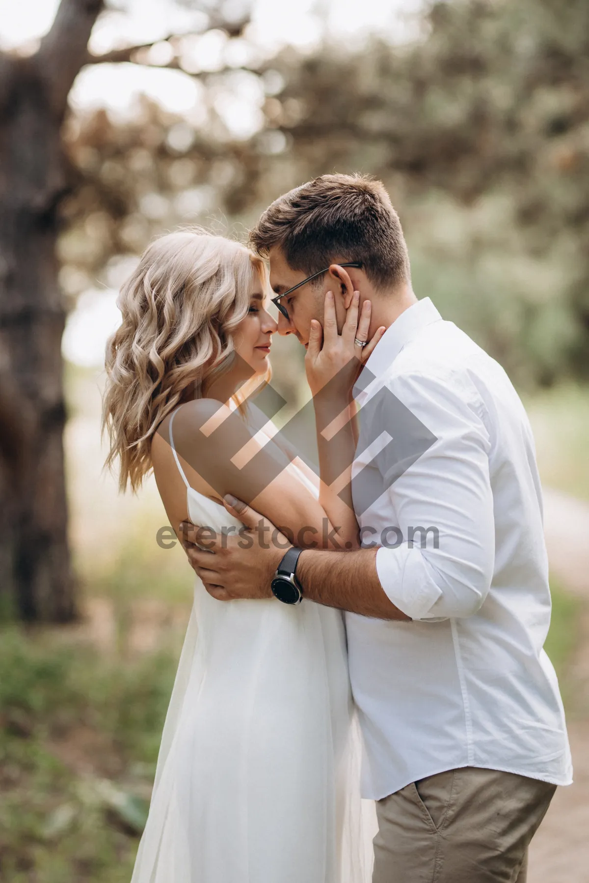 Picture of Happy newlywed couple in the park smiling together outside