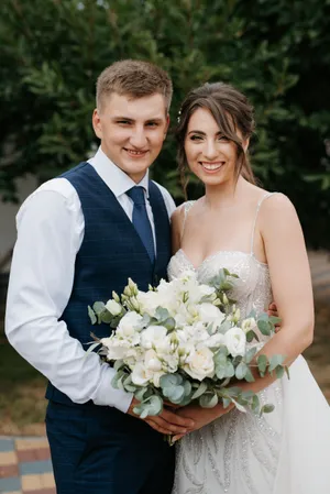 Happy Bride and Groom at Wedding Celebration Smiling Outdoors