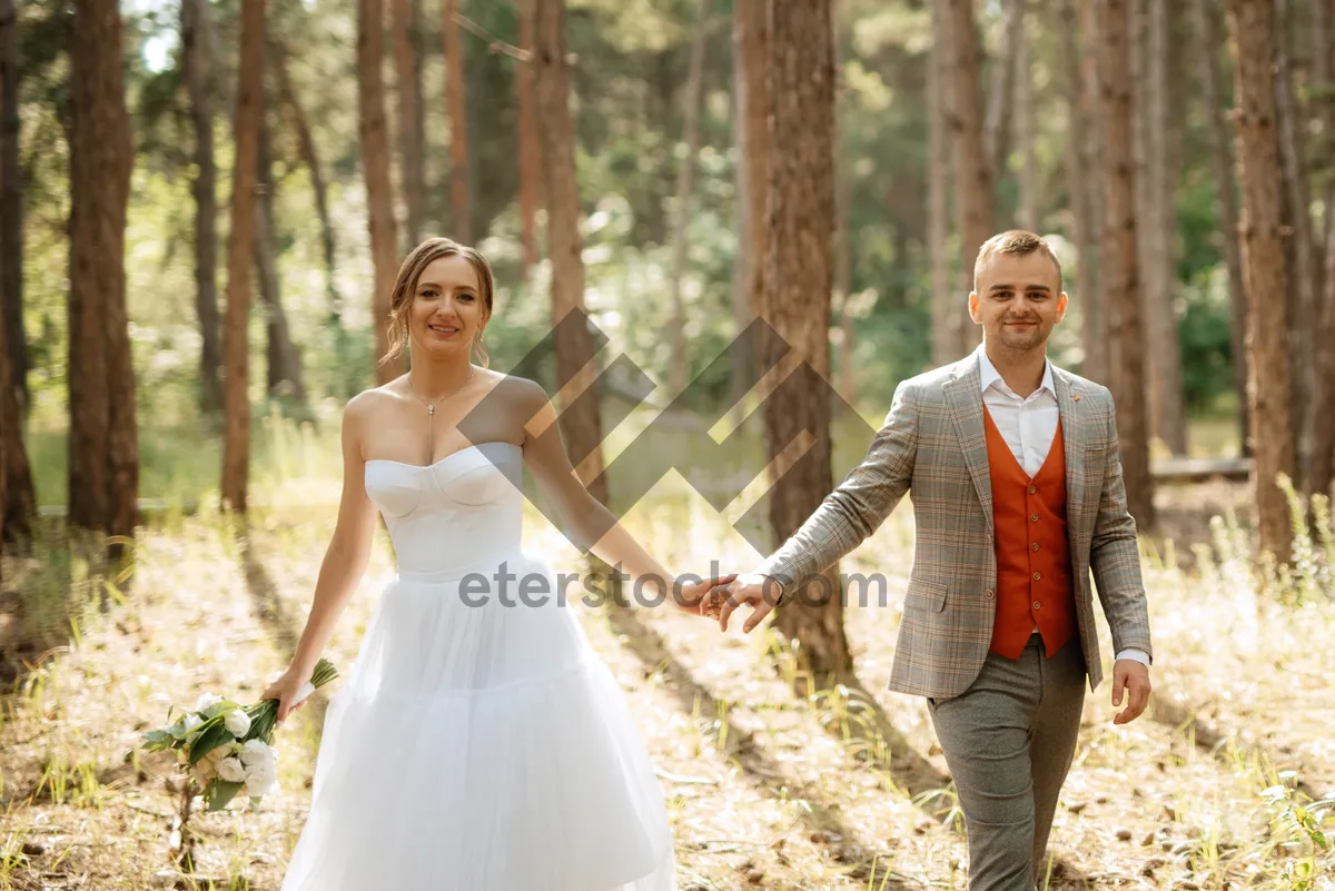 Picture of Happy bride and groom celebrating wedding day outdoors