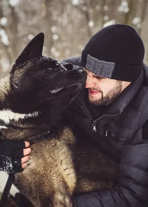 Person wearing black ski mask and dog mask portrait.