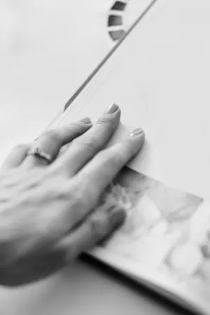 Close up of person's hand in office setting.