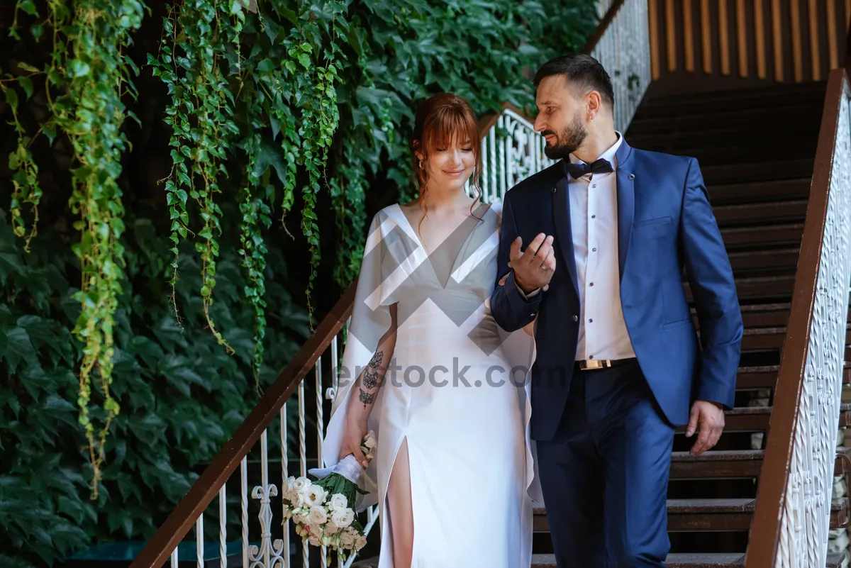 Picture of Happy wedding couple smiling outdoors