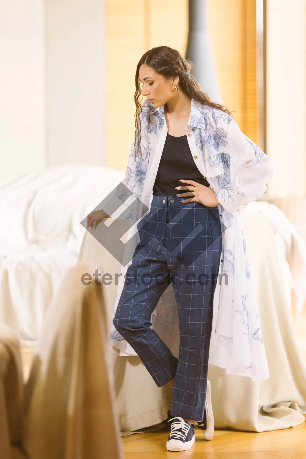 Picture of Smiling brunette businesswoman talking on the phone in office