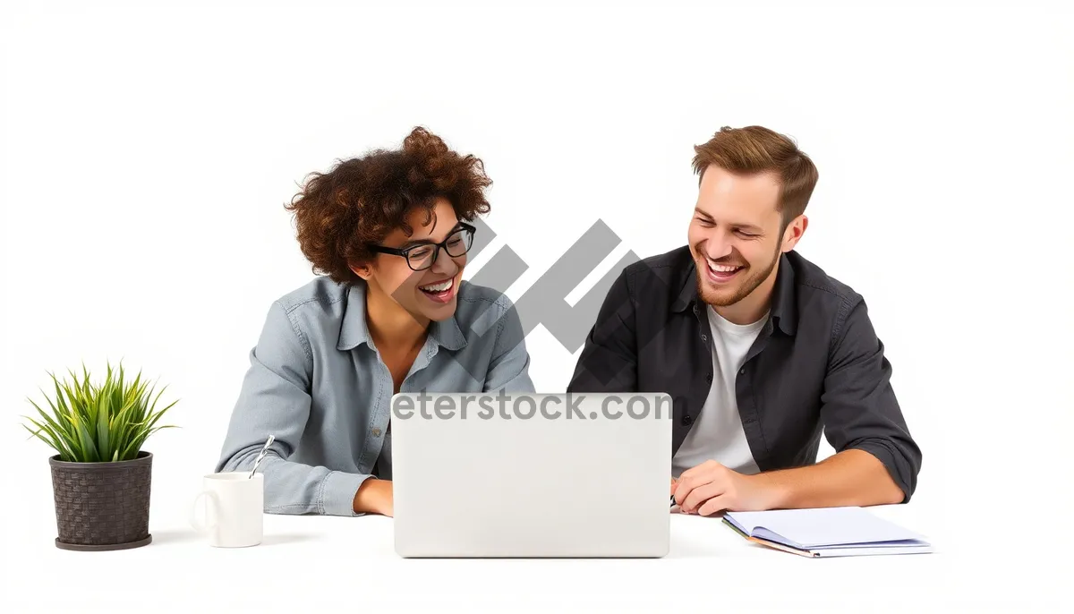 Picture of Happy businessman working on laptop in modern office.