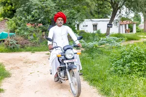 Healthy cyclist enjoying summer outdoor bike ride in park