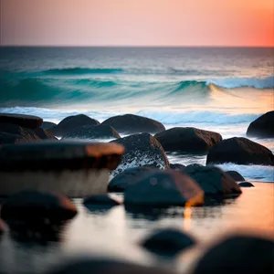 Tranquil Beach Sunset Over Ocean Waves