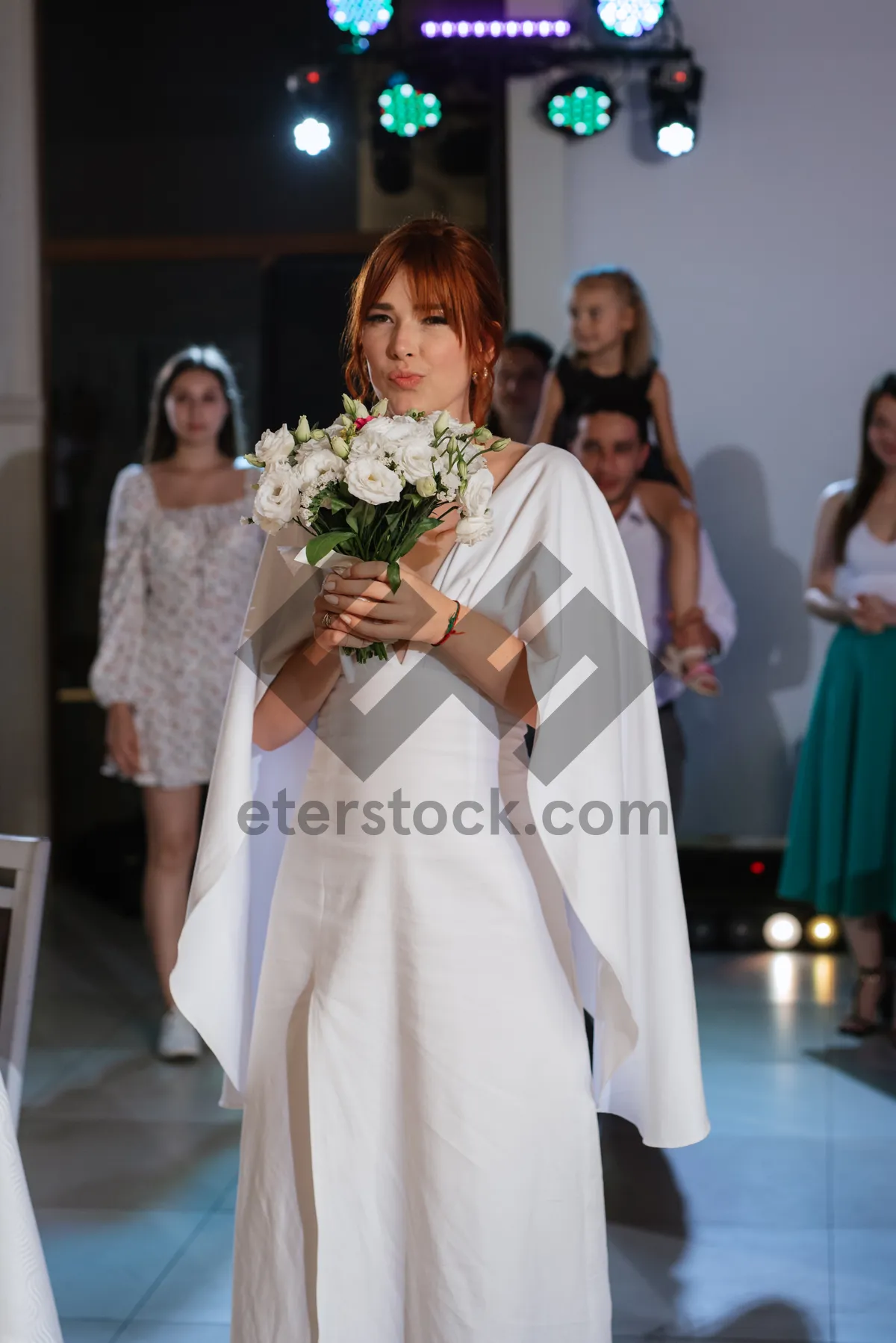 Picture of Smiling Couple Celebrating Wedding Day with Flowers