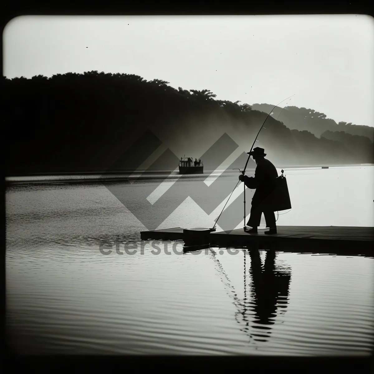 Picture of Silhouette Fisherman Enjoying Sunset on Boat