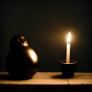 Burning Candlelight Illuminating Dark Night