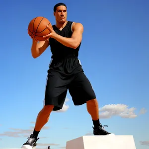 Active Male Basketball Player in Sportswear with Ball