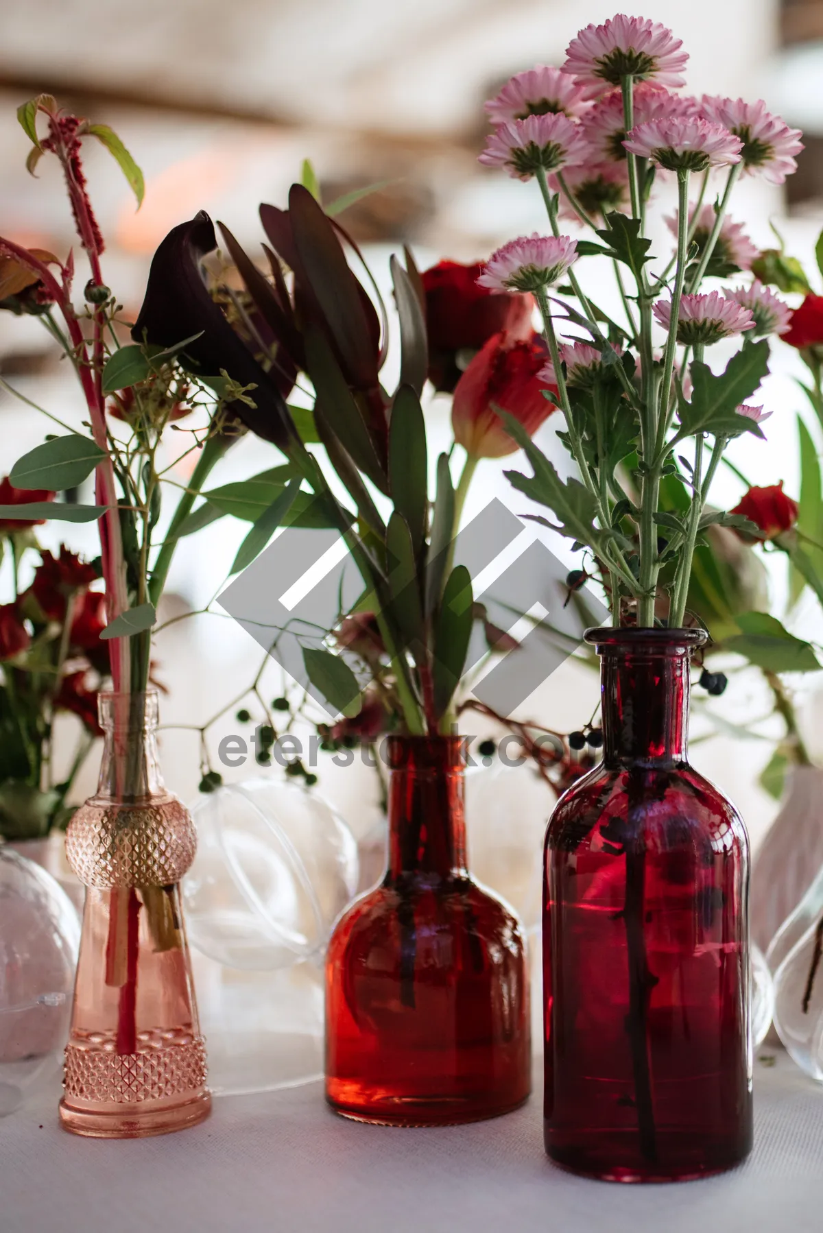 Picture of Glass jar with beautiful flower bouquet centerpiece