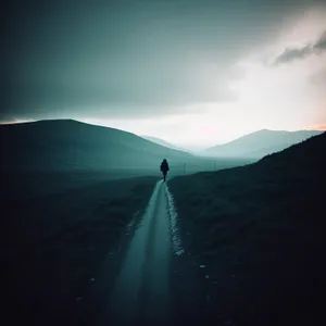 Scenic Mountain Road Under Sunny Sky