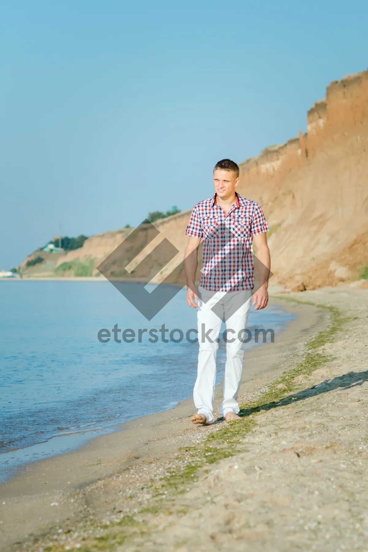 Picture of Happy Couple Enjoying Tropical Beach Vacation Under Sun