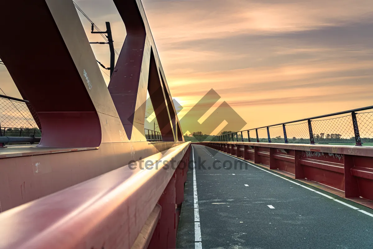 Picture of City skyline with suspension bridge and clouds