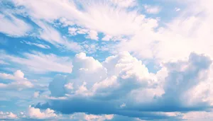 Bright Sunny Sky with Fluffy Clouds on a Clear Day