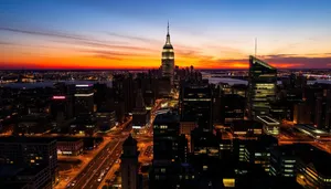 Modern city skyline at dusk with illuminated buildings