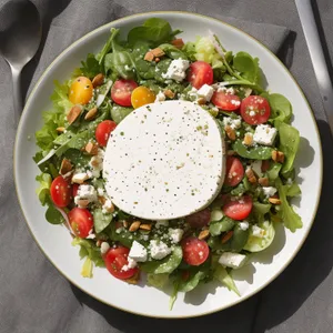 Delicious gourmet salad with fresh vegetables and cheese