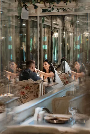 Happy couple dining at a restaurant table.