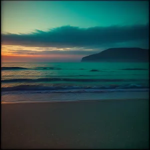 Serene Sunset Over Beach and Sea