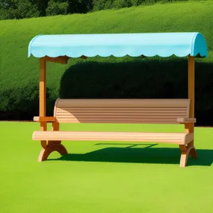 Swing seat on lush grass, an outdoor plaything