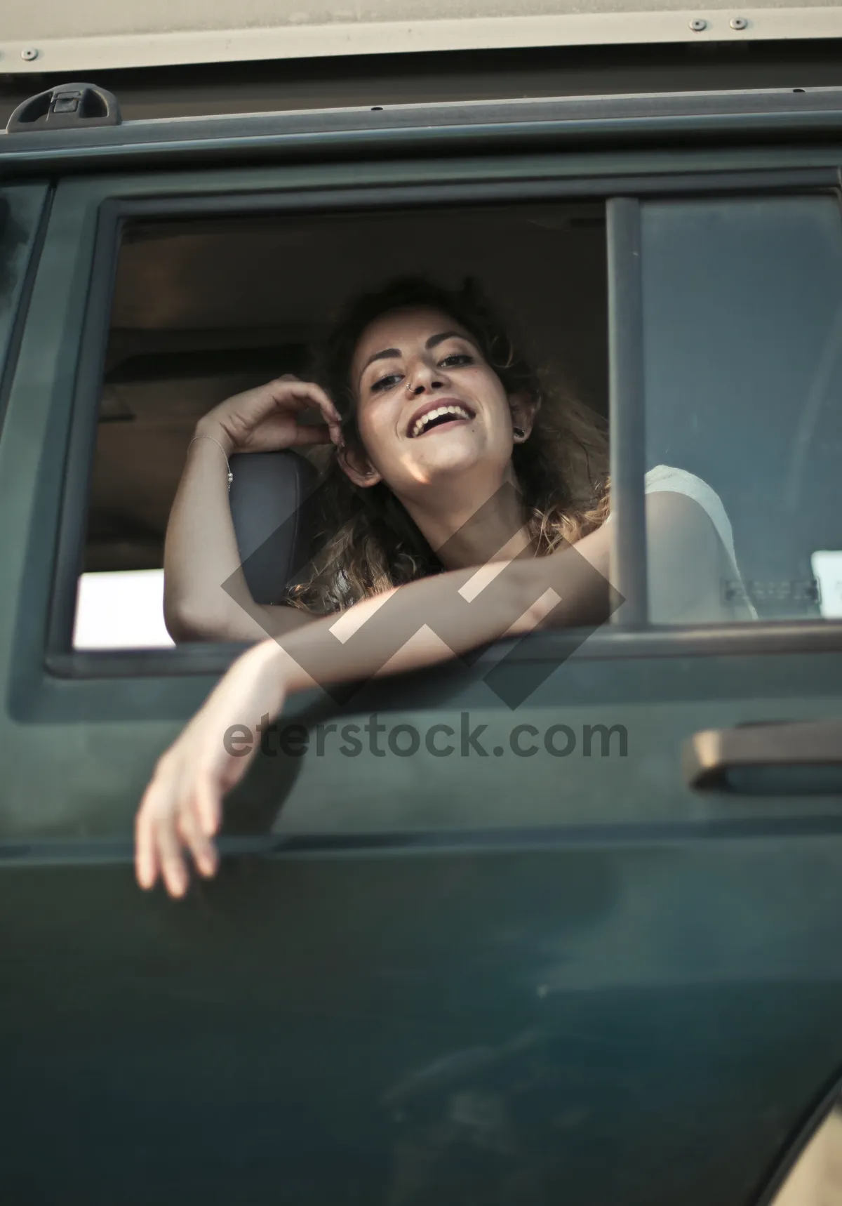 Picture of Attractive woman happy sitting in bathtub with car reflection