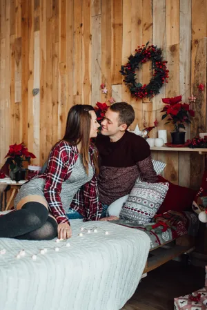 Happy family on the couch in pajamas.