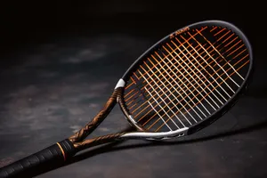 Tennis racket on court during competition game