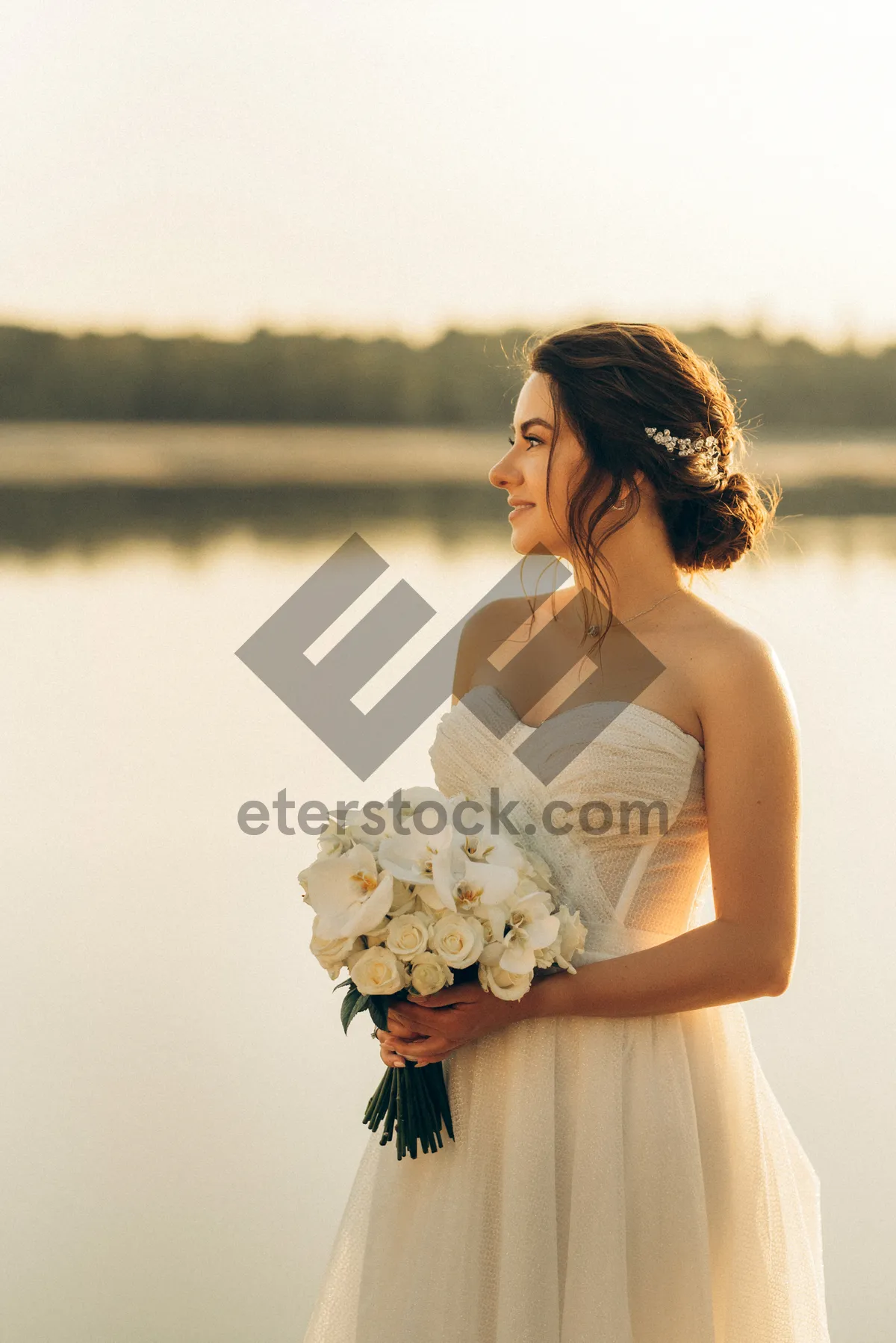 Picture of Gorgeous bride with bouquet smiling happily.