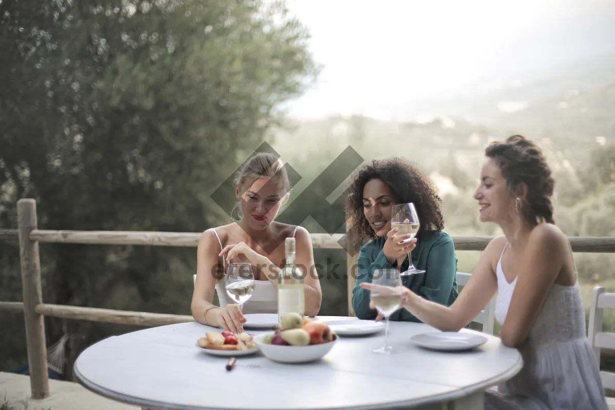 Picture of Happy couple enjoying wine outdoors.