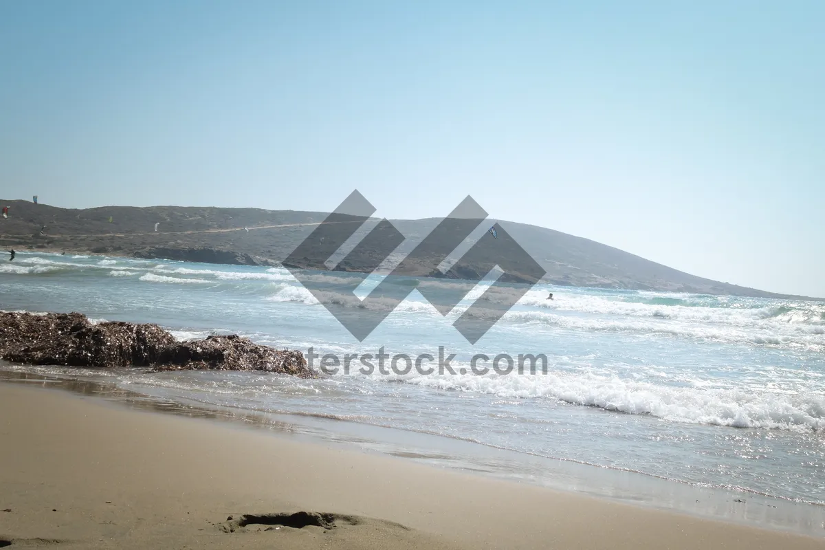 Picture of Tropical island beach with relaxing waves and sun.