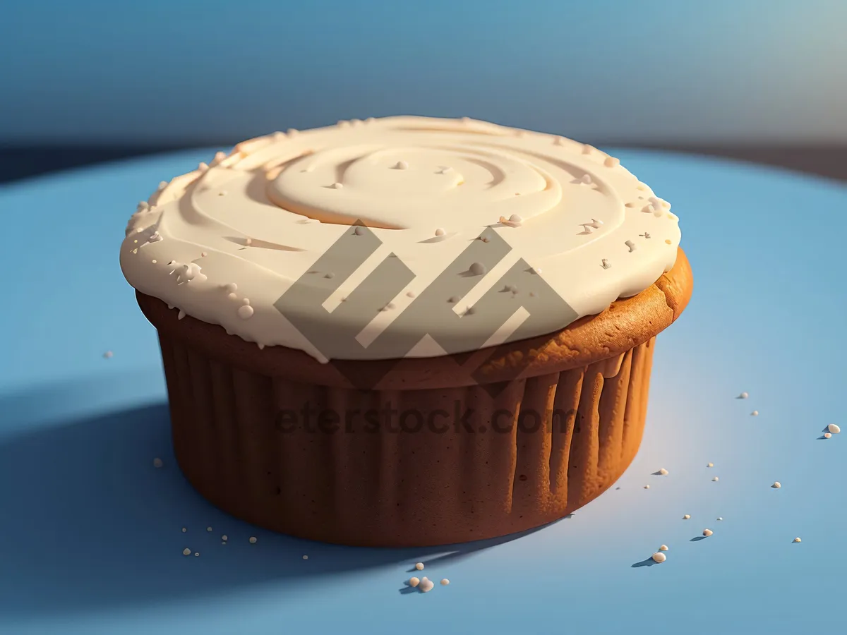 Picture of Pink chocolate cupcake with creamy icing and sprinkles.