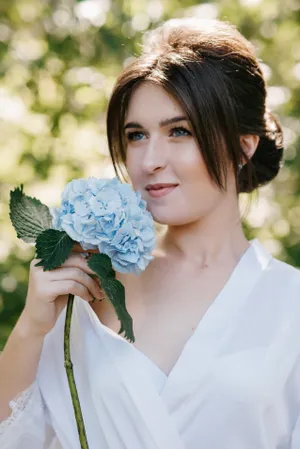 Happy bride with bouquet on wedding day