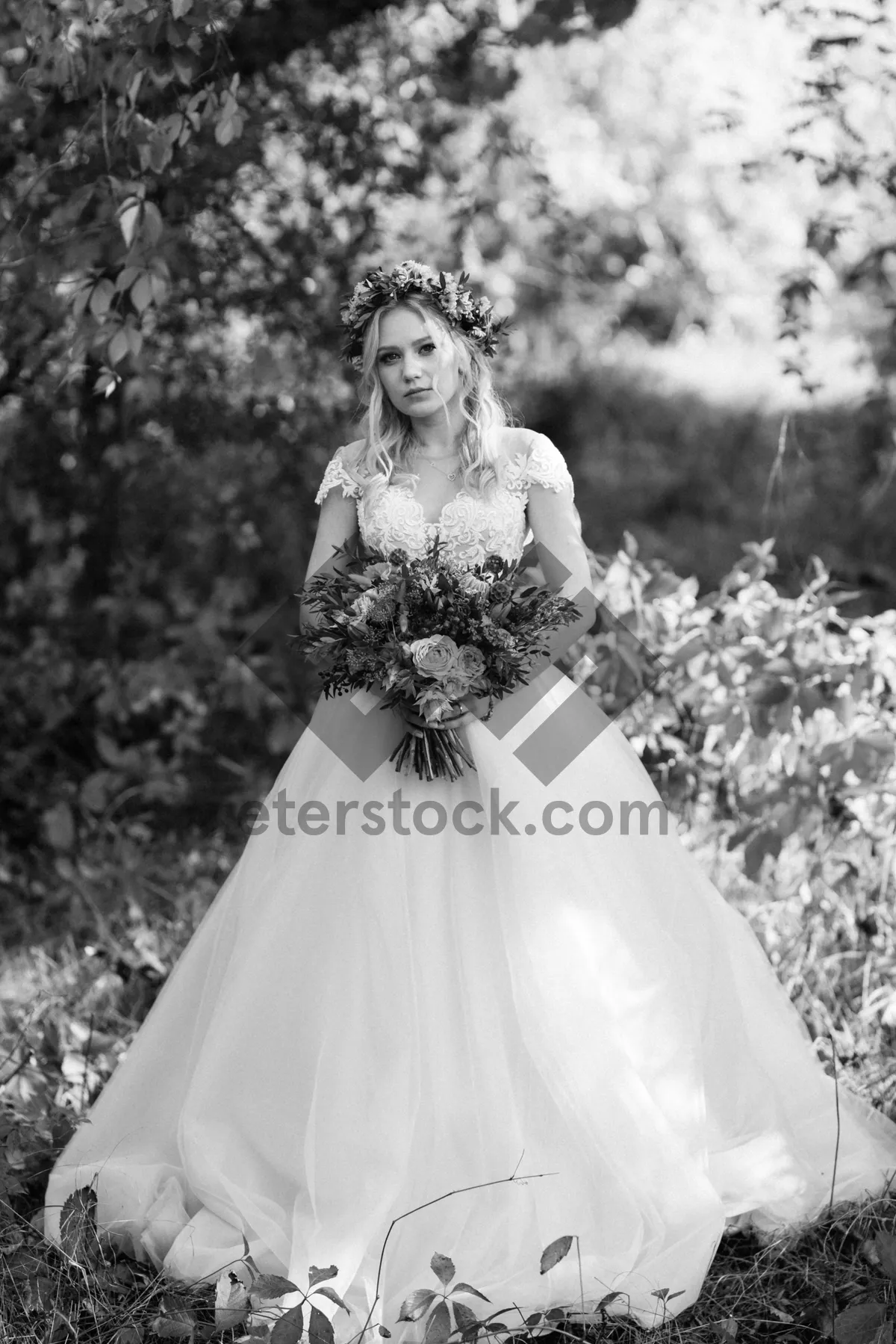 Picture of Happy bride and groom celebrating outdoors with flowers