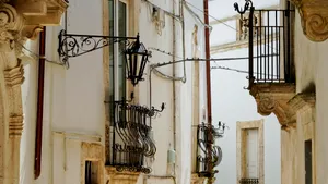 Old city architecture with balconies and electricity wires