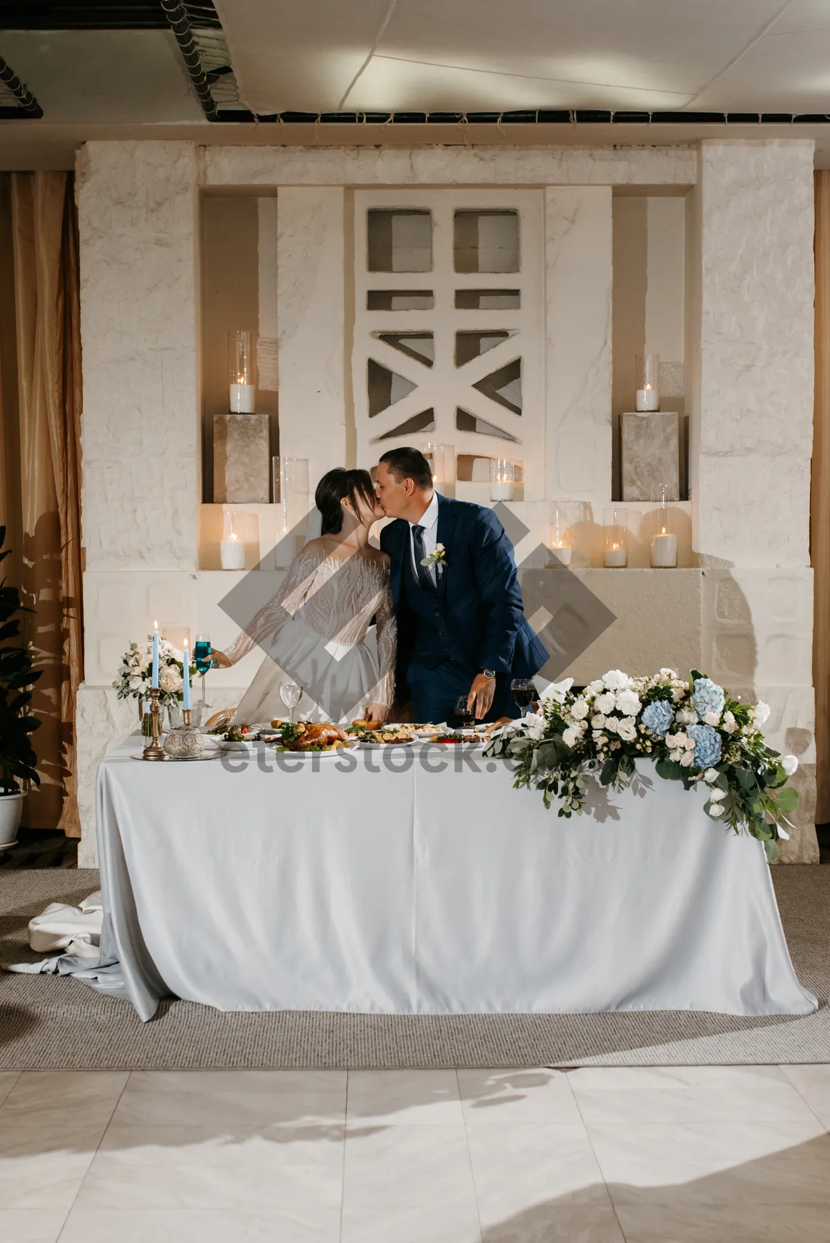 Picture of Happy married couple celebrating their wedding day with flowers