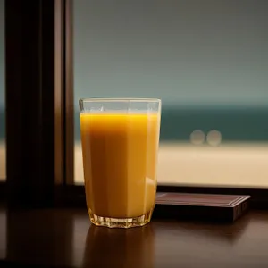 Refreshing Yellow Fruit Cocktail in a Frothy Mug