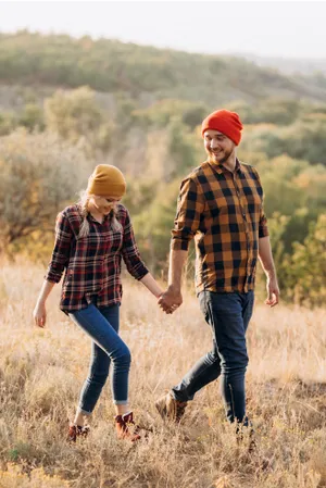 Happy man hiking in autumn meadow