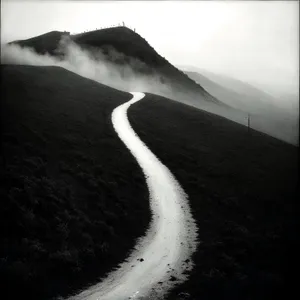 Majestic Coastal Ascent: Mountain, Ocean, and Sky