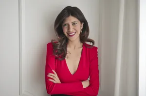 Attractive brunette businesswoman with a happy smile.