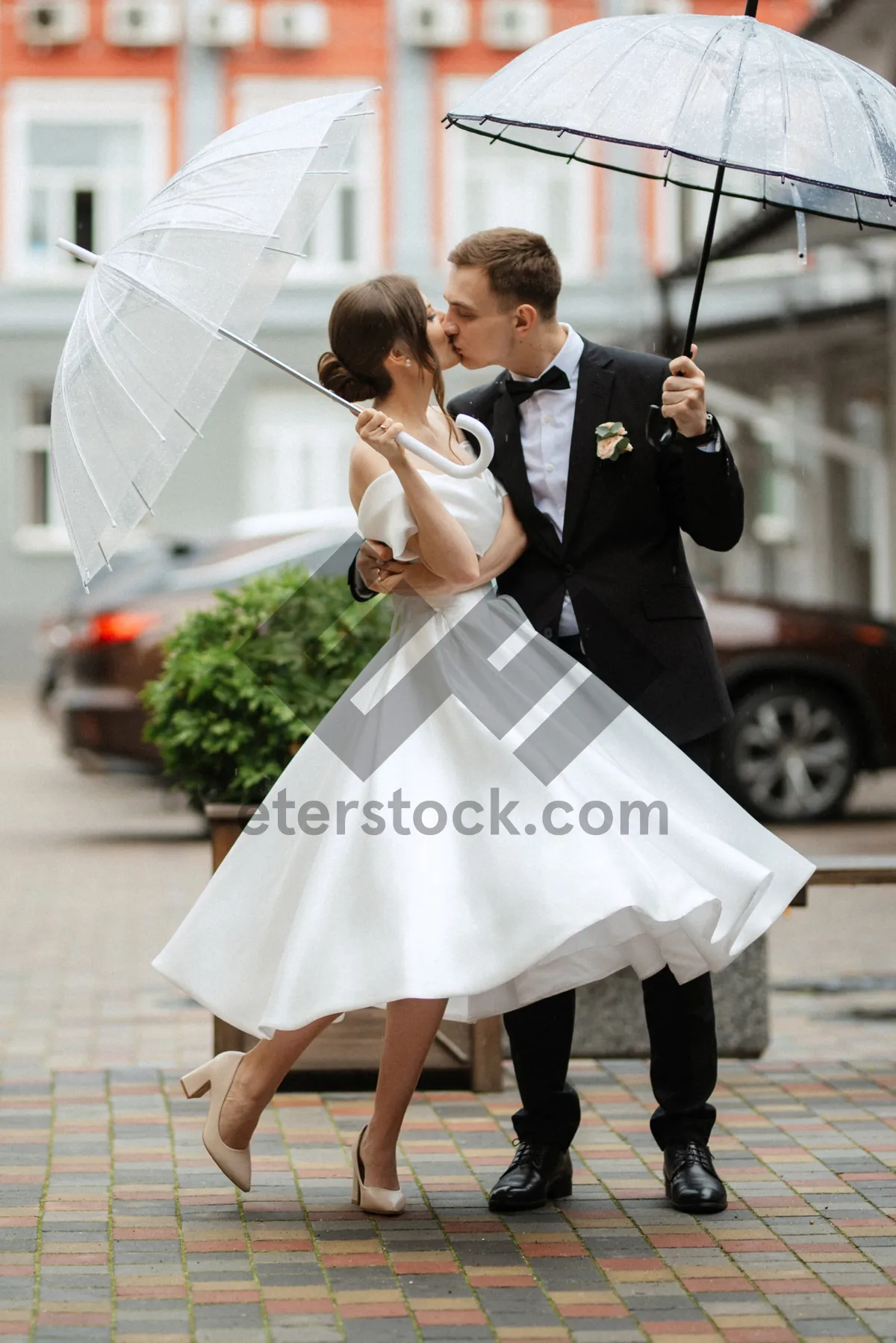 Picture of Happy Wedding Couple Outdoors Smiling Together with Flower Bouquet