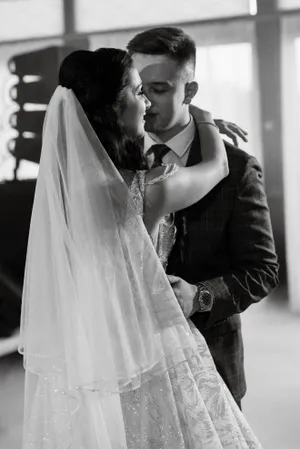 Happy married couple happily posing on their wedding day.