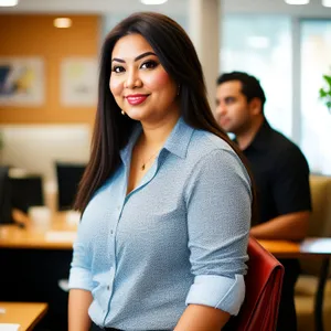 Happy professionals working together in a campus office setting